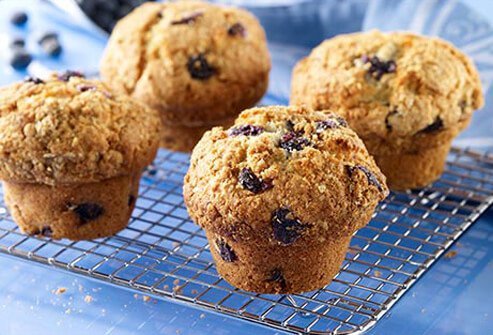 Photo of blueberry muffins on a cooling rack.