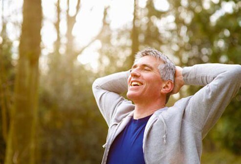 Photo of smiling man breathing.