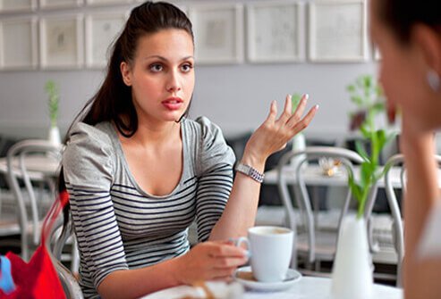 Friends having coffee, talk about their stress.