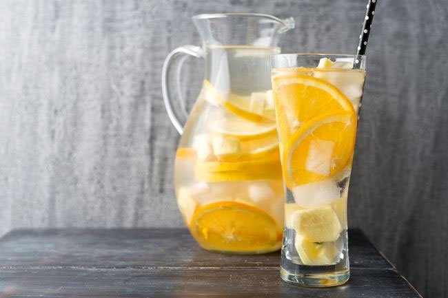 Adding contaminated fruit slices to water may introduce germs that may make you sick.
