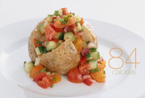 A halved baked potato with salsa.