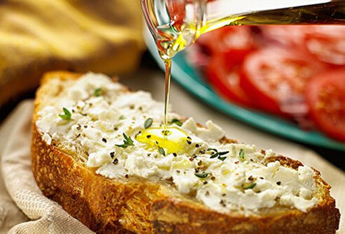 Photo of olive oil drizzled over bread.