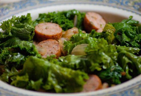 Photo of mustard greens and chicken sausage.