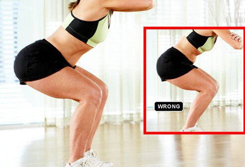 Keep your feet shoulder-width apart and your back straight.