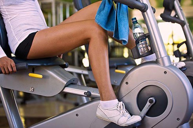 You can ride a stationary bike for about 5 minutes, take a brisk 2-minute walk while pumping your arms, or do 15-20 wall push-ups followed by the same number of calf raises.