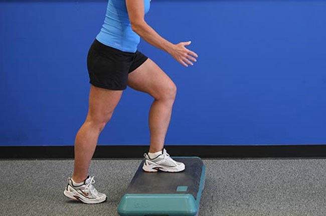 Place one foot on a step bench, platform, or the lowest step on a staircase. 