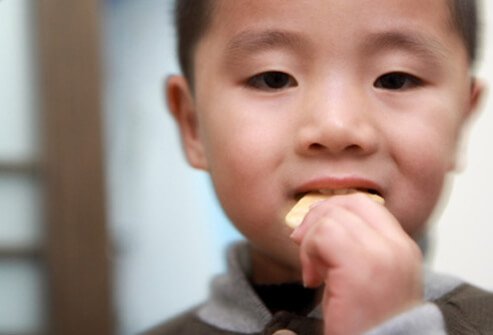 Bland foods like crackers, applesauce, bananas, and rice can help settle your child's stomach.