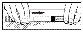 After the needle is inside the labeled cover, push the unlabeled half of the carrying case cover firmly over the non-needle end of the Adrenaclick - Illustration