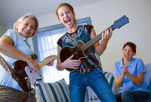 Photo of a senior woman having fun with her granddaughter.
