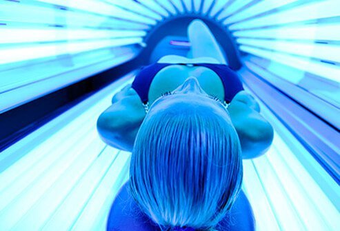 Photo of woman on tanning bed.