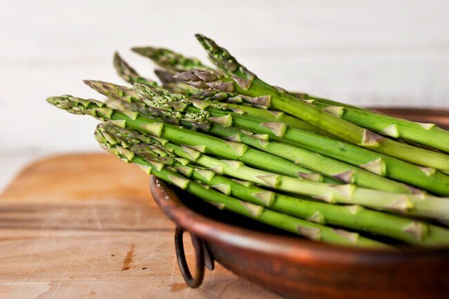It is best to store asparagus with the ends trimmed standing in a glass of water.