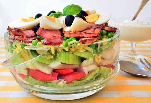 A 7-layer salad with eggs, cheese, and bacon is not health food.