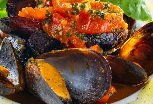 Create a simple broth of onions, garlic, white wine, tomatoes, and a bit of olive oil.