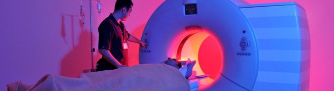 Picture: A medical technician prepares a patient for an MRI to check for a possible brain tumor