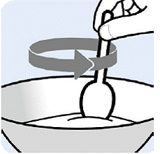 Gently mix the Oral Pellets with a spoon
into the soft food - Illustration