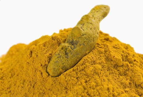 A heap of tumeric root powder.