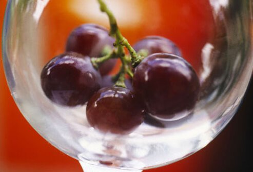 Red grapes in a glass bowl.