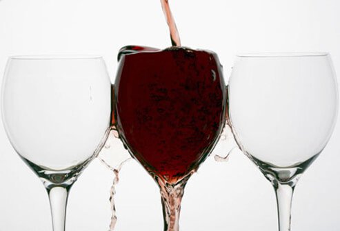 Red wine spilling out of a glass.