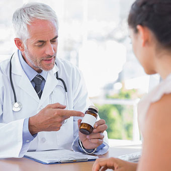 A doctor explains a medication to a patient.