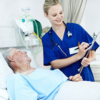 A nurse prepares a patient prior to the colonoscopy procedure.