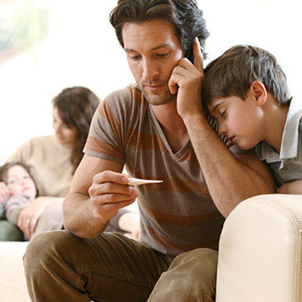 A dad calls the doctor for his sick child.