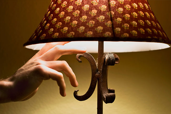 Use blackout curtains to block out street lights to help you sleep better.