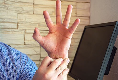 Pain at the side of the wrist beneath the base of the thumb is a symptom of de Quervain's tenosynovitis.