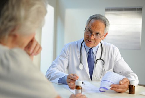 A doctor prescribing medication to a dementia patient.