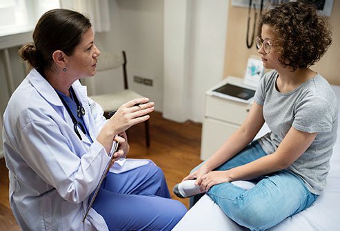 Picture of a doctor talking to a patient.