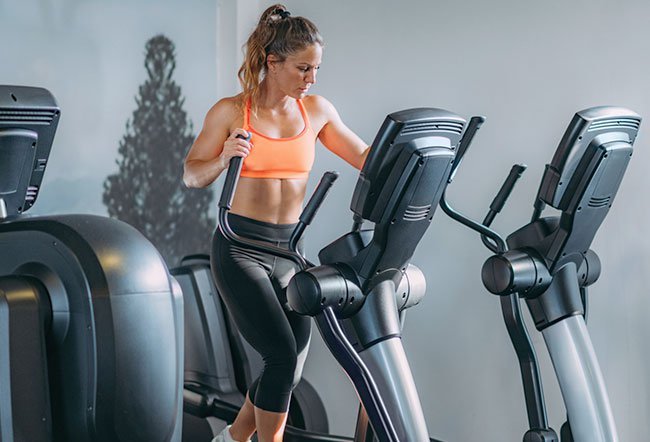One can lose belly fat by adhering to a strict diet plan and exercise regimen and by making a few lifestyle modifications. Elliptical trainers can help burn calories, reduce belly fat and tone the body.