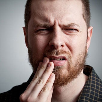 Symptoms of dry sockets are often painful.