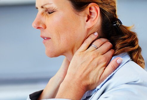 A woman suffering from fibromyalgia pain.
