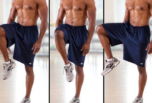 Stand with your arms at your sides, feet hip-width apart.