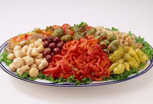A photo of a salty plate of antipasto.