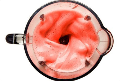 An overhead view of a fruit smoothie.