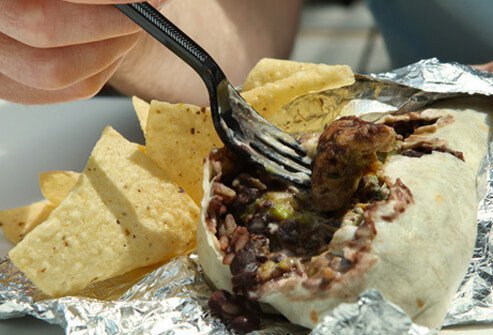 A close up of a chicken burrito.