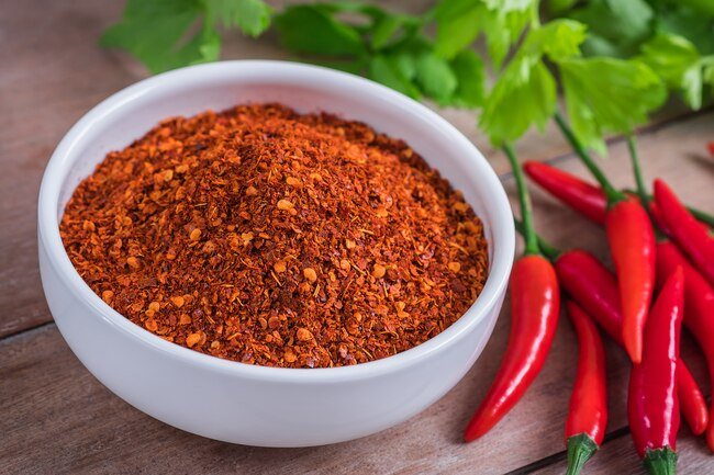 Capsaicin in peppers relaxes muscles in blood vessels improving blood circulation.