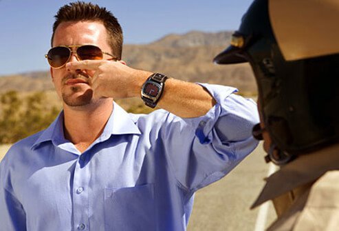 Photo of man taking sobriety test.