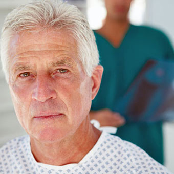 A senior male patient and doctor.