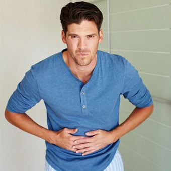 A man experiences pain from biliary colic.