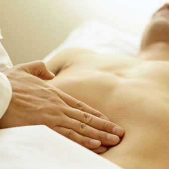 A doctor examining a gallstone patient.