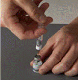 Gently tap the barrel of the Diluent syringe with a
finger - Illustration