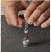 After 30 seconds, place the GATTEX vial between the palms of your hands. Gently roll the vial for about 15 seconds - Illustration