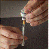 Fill the plastic dosing syringe until the black tip of
the plunger lines up with the mark that matches your prescribed dose  - Illustration