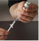 gently tap the side of the plastic dosing syringe with a finger to make any air bubbles rise to the top - Illustration