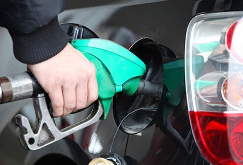 A man pumps gas into his car.