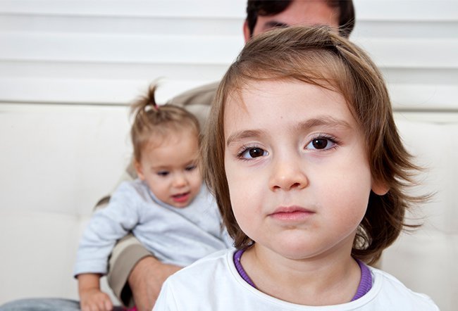 what age can a child stay home with sibling