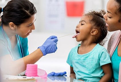 Strep throat tonsils are red and swollen and may have white patches.