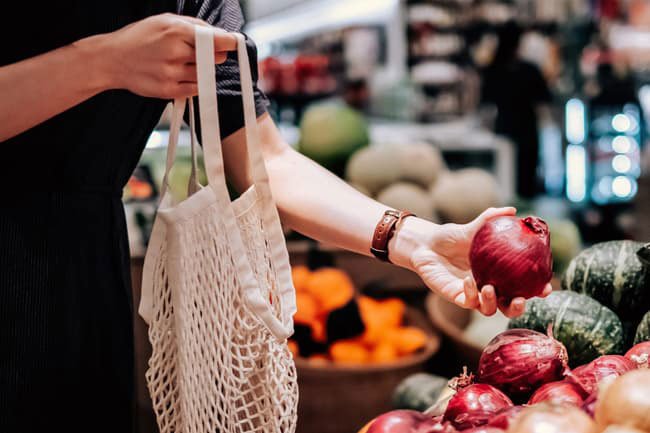 A fresh onion is firm and has no soft spots and has dry outer skin.