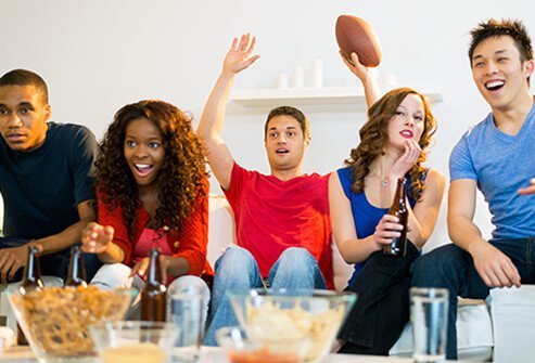 A group of friends watching sports.